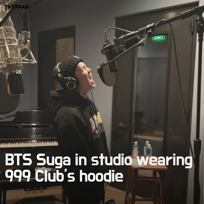 BTS Suga in studio wearing 999 Club's hoodie