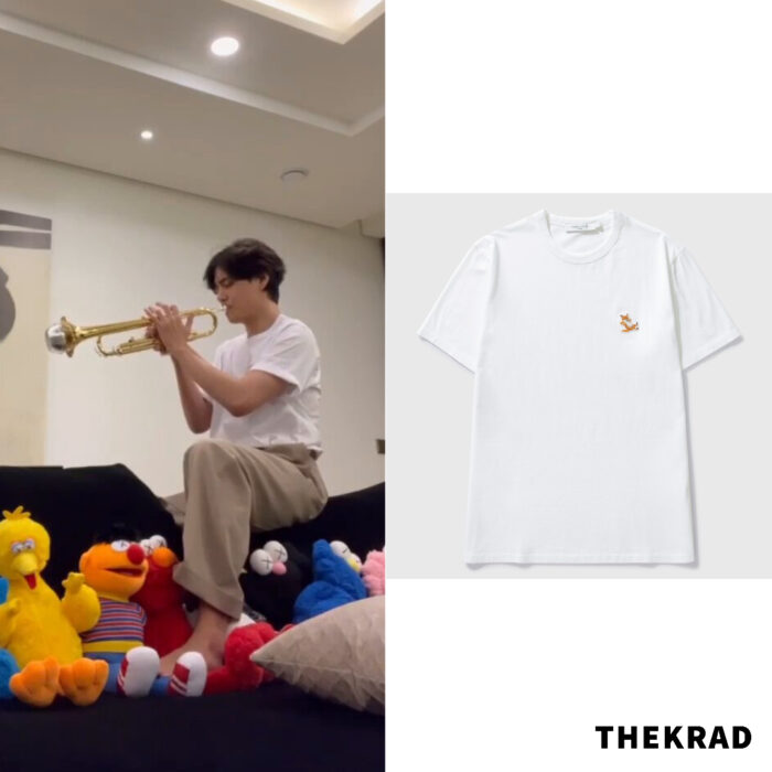 BTS V plays a trumpet in a simple logo patched tshirt by Maison Kitsune