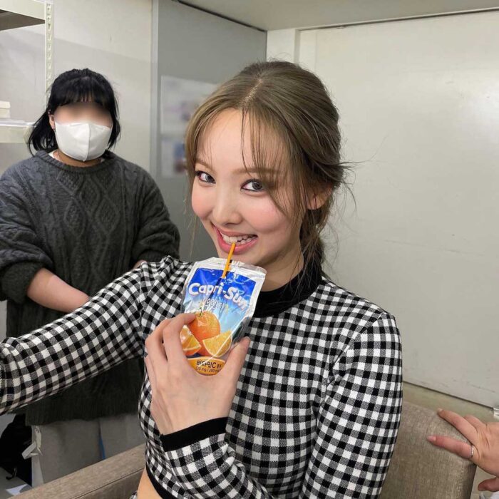 Twice Nayeon outfit from June 9, 2022 : Michael Kors sweater and more
